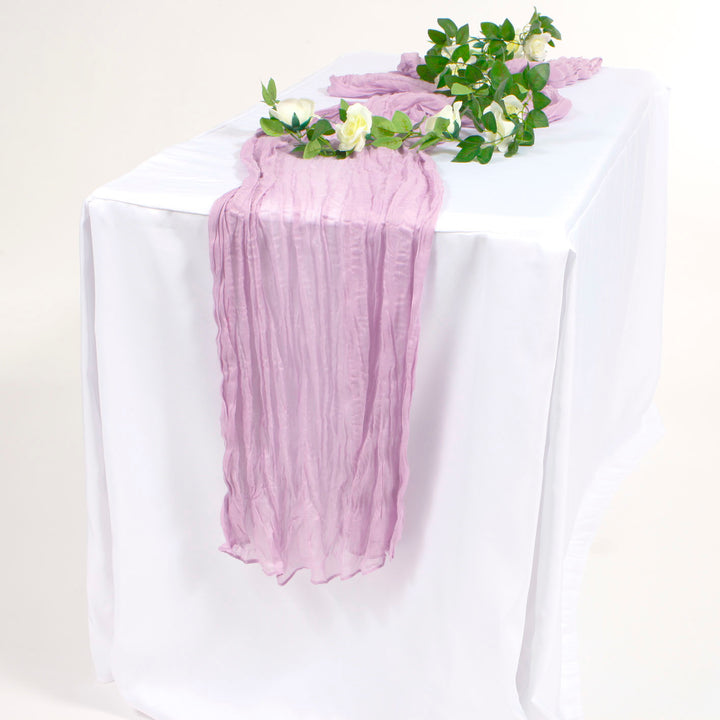 Lavender Purple Cheesecloth tablerunner on white tablecloth with white rose vine