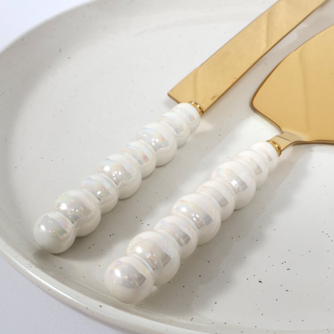 Cake Knife & Server Set - Bubble Handle - Gold (2pc) sitting on a plate
