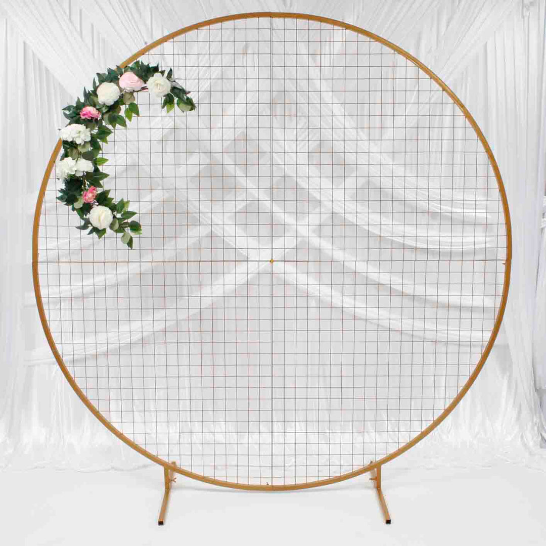 2m gold round mesh frame with greenery garland with large white, pink flowers and smaller pink/peach and white flowers.