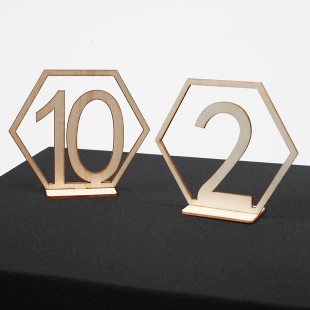 Wooden Table Numbers 10 and 2 on black tablecloth