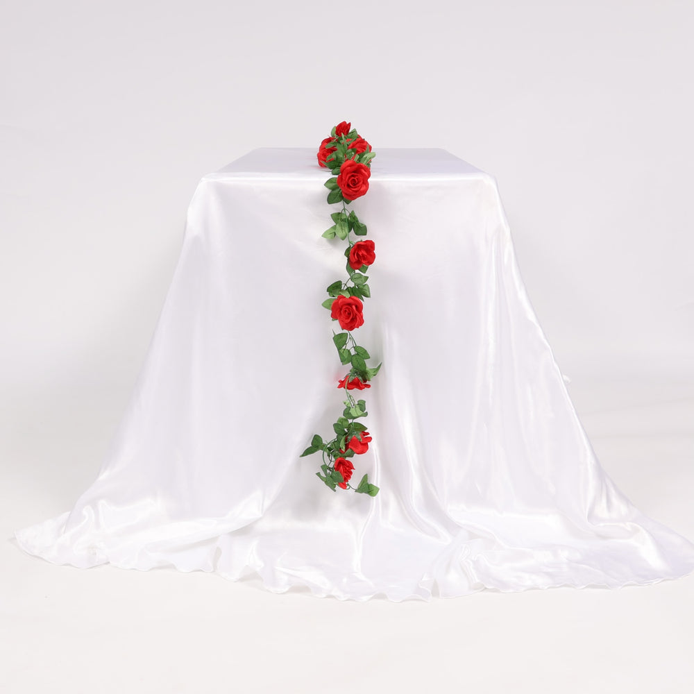 Decorative red rose garland on a white tablecloth
