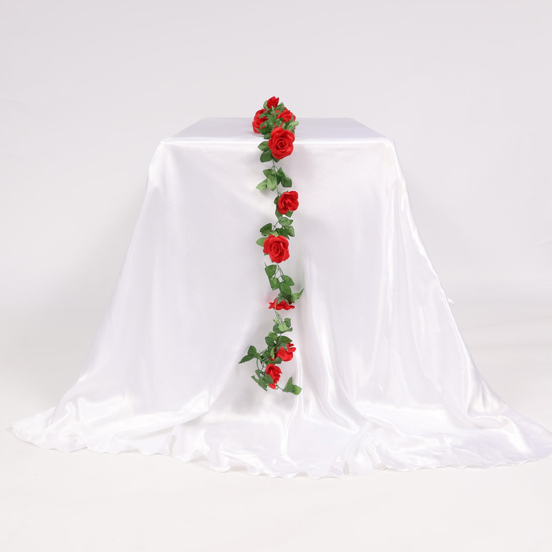 Decorative red rose garland on a white tablecloth