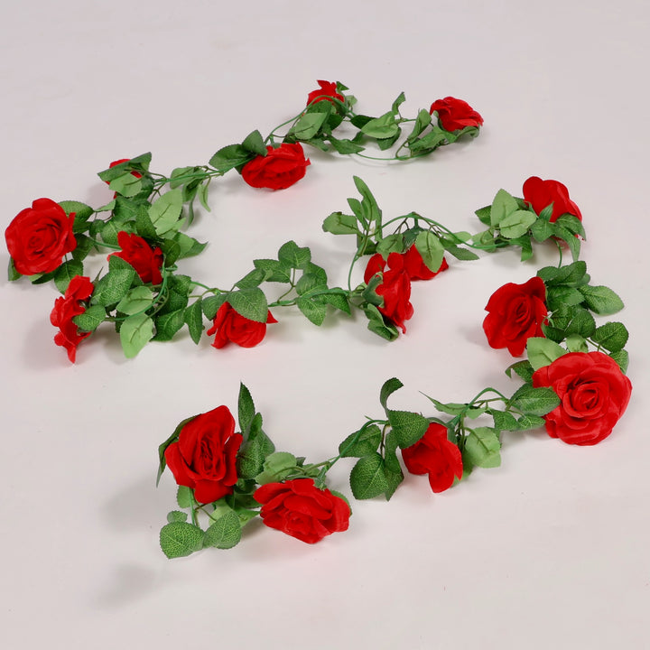 Artificial red rose garland on a white background