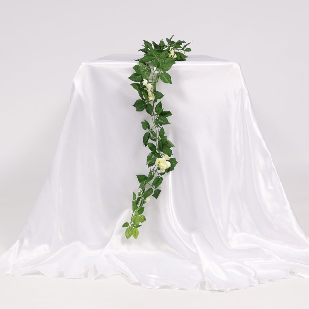 2pc Rose Artificial Flower Vine - 4cm Head - White (1.6m) hanging over edge of table
