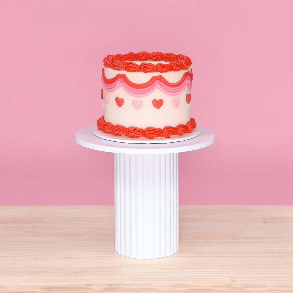 Cake Stand - Ribbed - White (25x20.5cm), pink background with small red and pink decorative cake on top