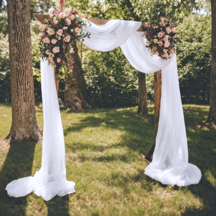 Styled image of the Sheer Stretch Crepe Chiffon Fabric - White (1.6x28m) on an arbour