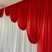 Ice Silk Satin Draping Backdrops - 6 meters length x 3 meters high - Red. Close upIce Silk Event Backdrop with Venetian Contour Stage Curtain / Valance Swag (Red and White) 3m wide x 3m high close up