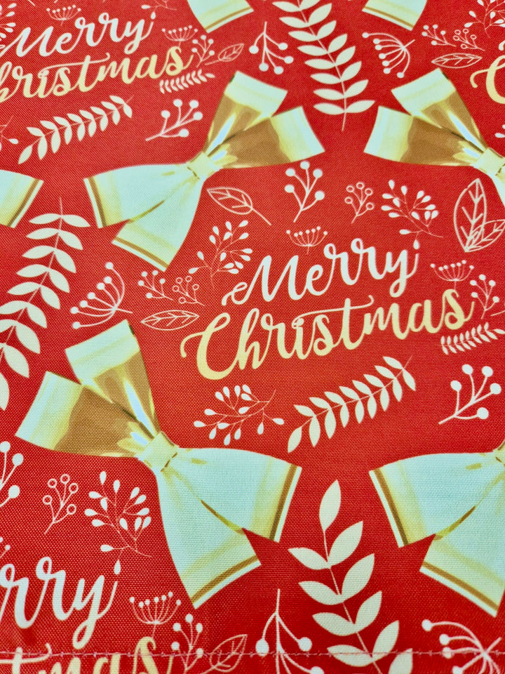 Christmas Cloth Napkins - Merry Christmas Gold Bows on Red (50x50cm) close up
