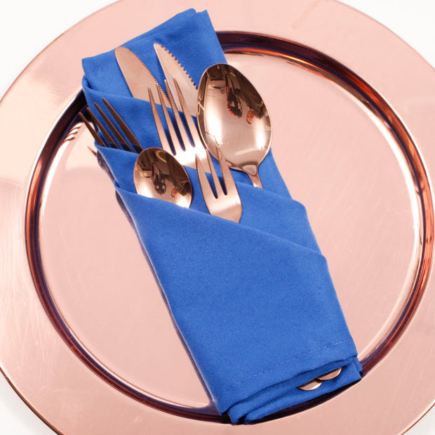 Cloth Napkins - Royal Blue (50x50cm) with a rose gold cutlery set on a rose gold charge plate