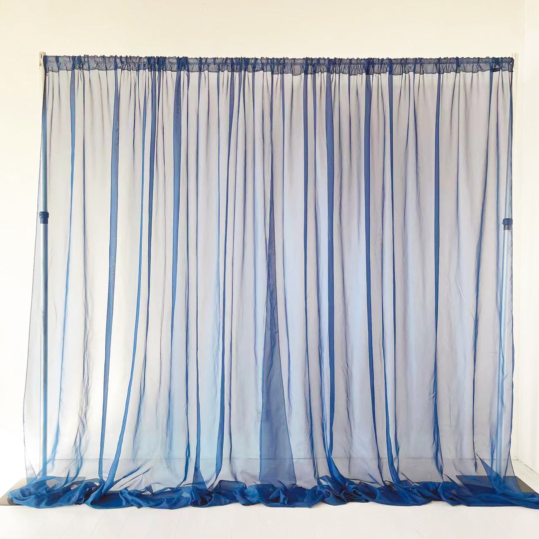 Navy chiffon curtain, centre split, draping onto ground