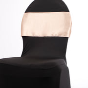 Peach satin sash on black lycra dining chair cover