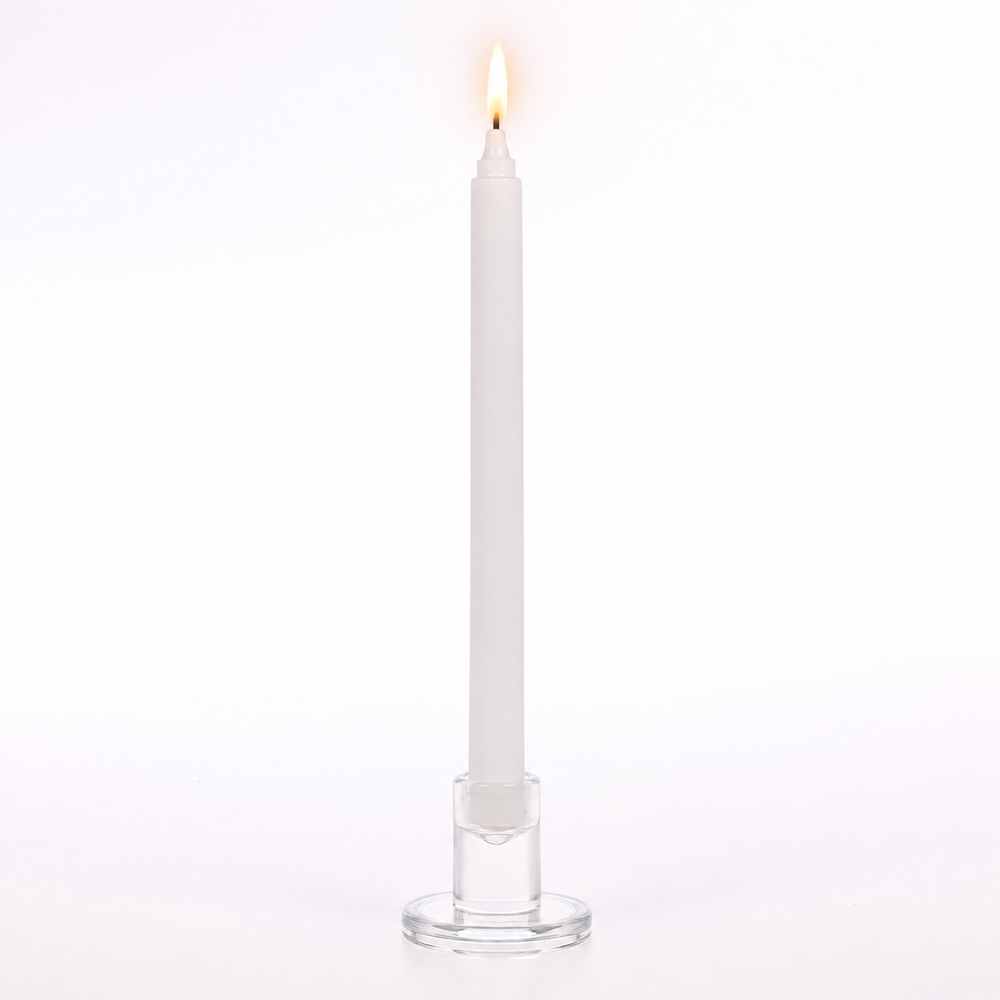 White Ribbed Dinner Taper Candle in Glass holder lit.