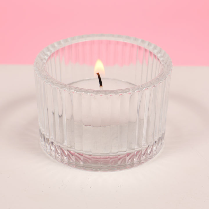 Ribbed Glass Tea Light Candle Holder with candle (side view)