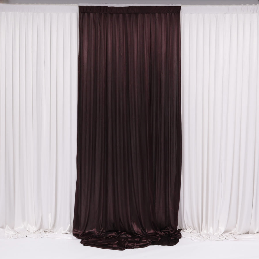 Brown curtain in front of white draped fabric