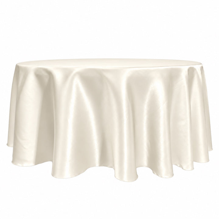 An ivory satin round tablecloth draped over a circular table, shown against a plain white background.