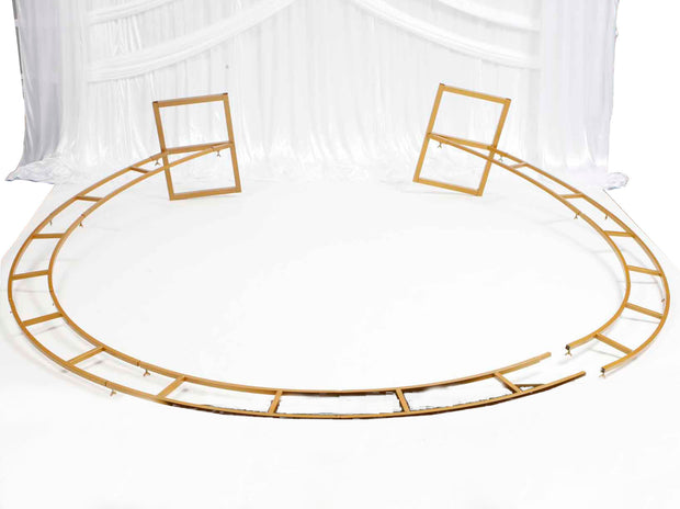 Gold Round Wedding Arch lying flat on ground to demonstrate how to put it together