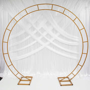 Gold Round Wedding Arch in front of white backdrop