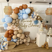 Autumn THeme Balloon Garland Baby shower setup with WHite plinths and cake standsup