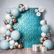 Sequin Shimmer Wall Backdrop Panels - Blue Example wall with blue, white and chrome balloon garland. white and brown presents, white fan decorations