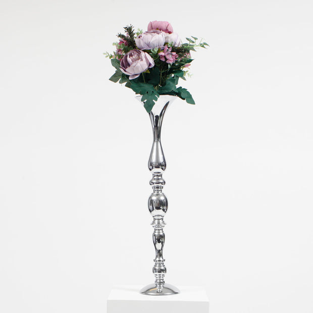 lavender & maauve coloured rose, with green foliage bouquet in silver vase on white background