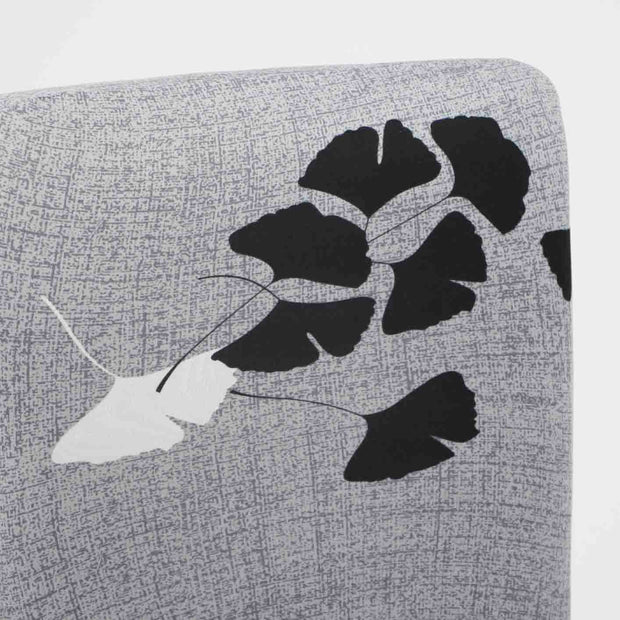 grey chair topper close up of black white leaf design