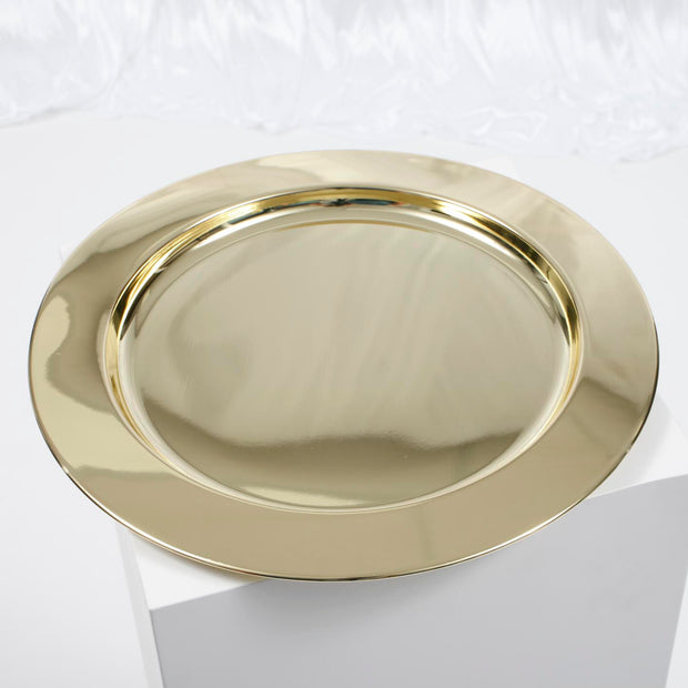Gold mirror charger plate on white backdrop