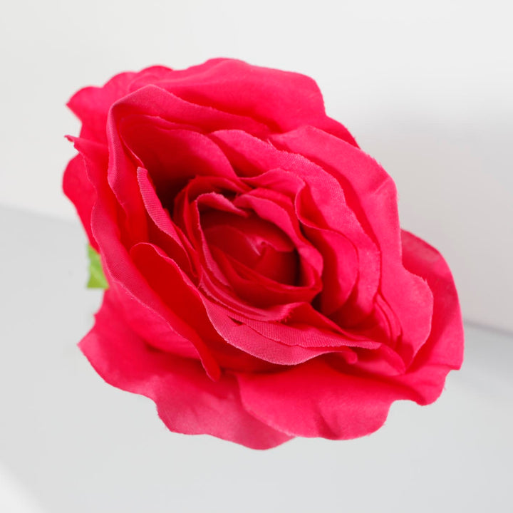 CLOSE TOP VIEW HOT PINK SINGLE ROSE