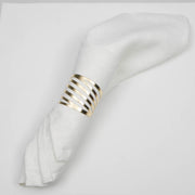 White Linen Napkin Rolled with Gold cut out Napkin Ring