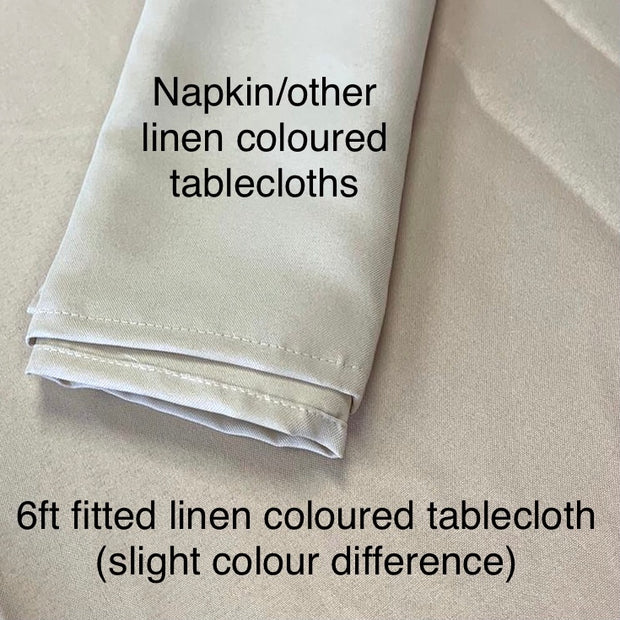 A linen coloured napkin on the 6ft linen coloured tablecloth to show the slight colour variation. the tablecloth is slightly darker shade