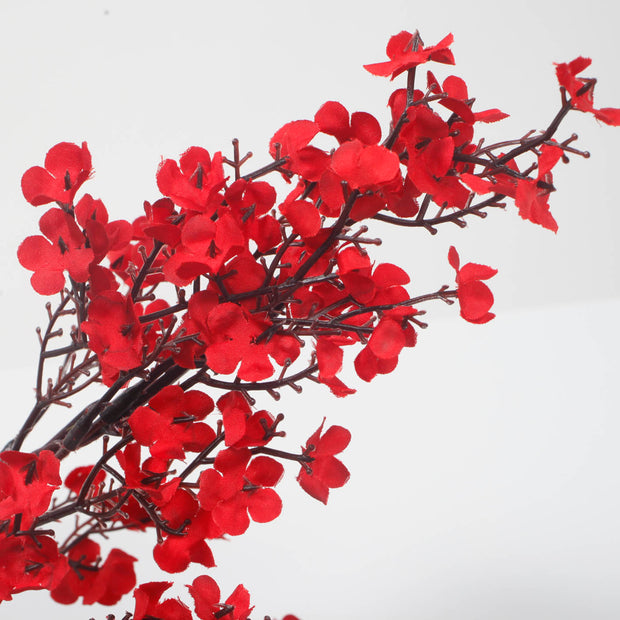 silk chery blossoms in red for events close up